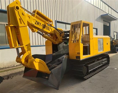 Mucking Loader har band- och hjultyp